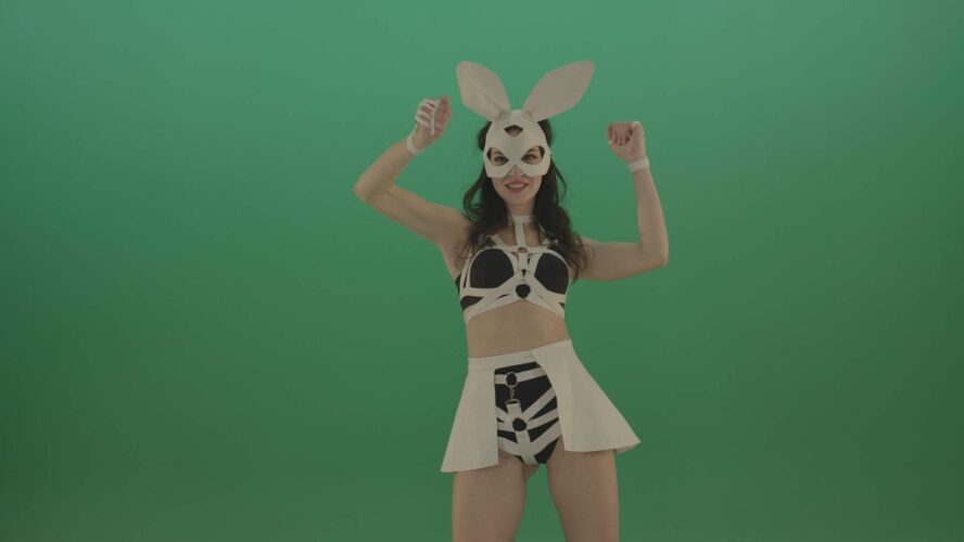 Girl in rabbit mask dancing on green screen