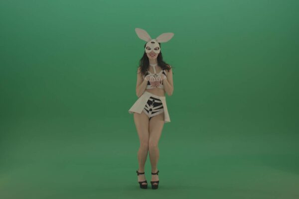 Girl in rabbit mask dancing on green screen video footage
