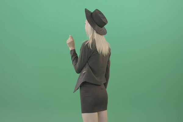 luxury woman working with virtual touch screen on green screen
