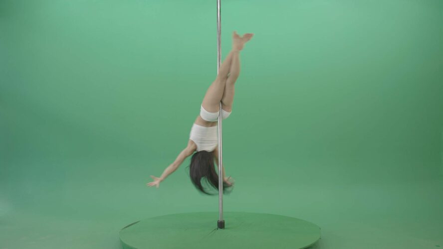 Pole dancing girl on green screen